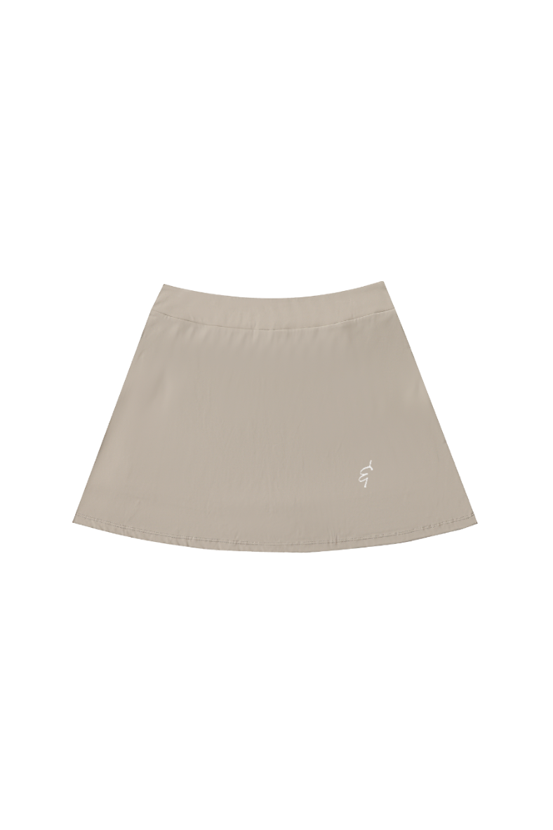 Beige skirt with a small logo of an ampersand on a white background