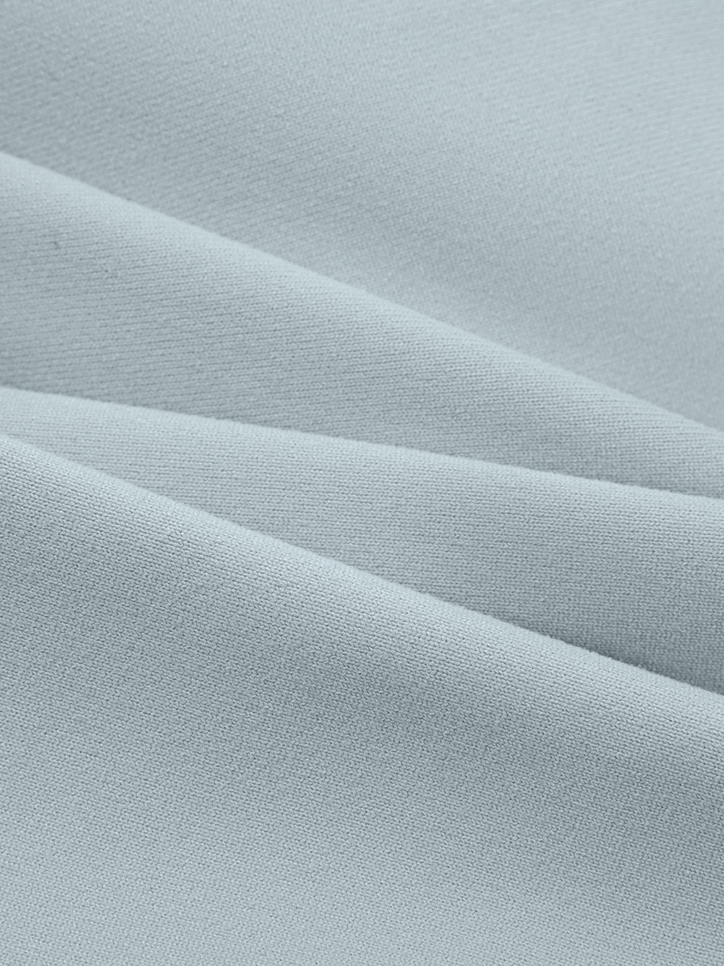 Close-up of light blue fabric with subtle texture