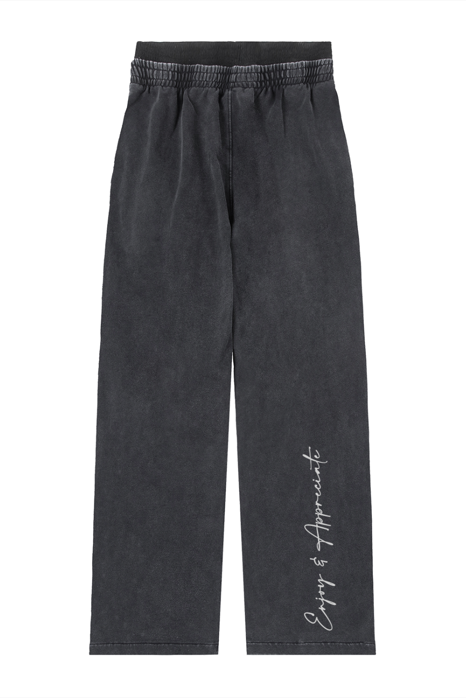 Black wide leg sweatpants with a relaxed fit, elastic waistband, and white cursive enjoy is appreciate script on the leg