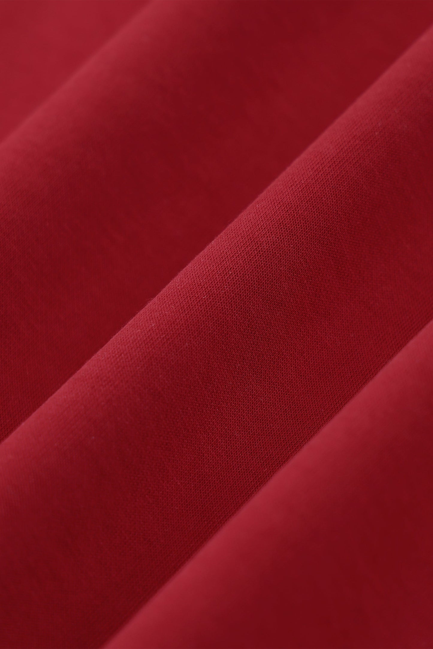 Close-up of red fabric with a textured surface