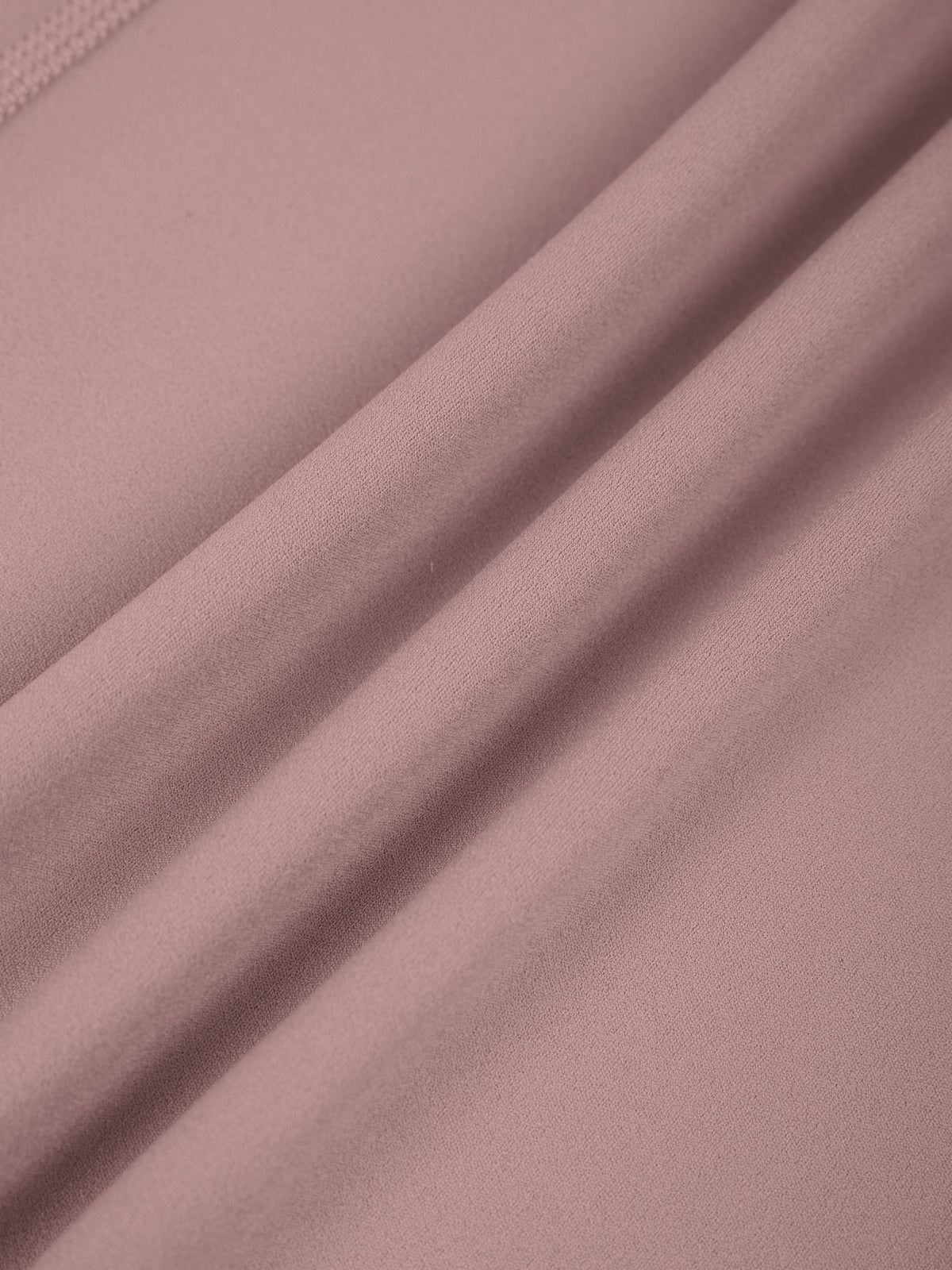 Close-up of pink fabric with folds