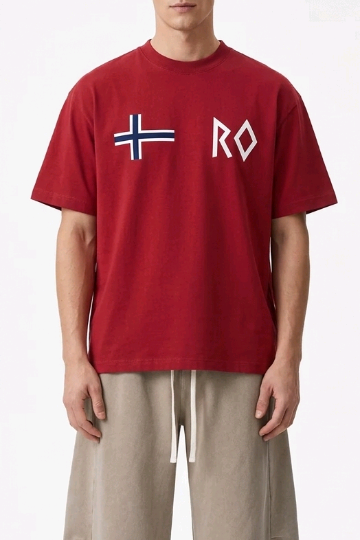 Two male models wearing matching red short-sleeve t-shirts with a white Nordic flag and 'RO' graphic on the chest, styled with beige drawstring pants against a clean white studio background.