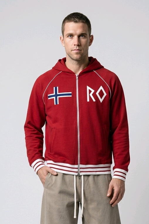 A man modeling a red zip-up hoodie with a white front zipper, white drawstrings, a white and blue Nordic flag on the left chest, and 'RO' in white on the right chest. He is wearing beige drawstring sweatpants and white sneakers against a light gray studio background.