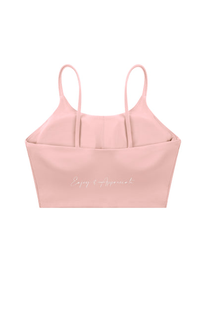 A pink structured camisole top with thin shoulder straps and a white cursive script reading 'Enjoy & Appreciate' on the front, shown against a plain white background.