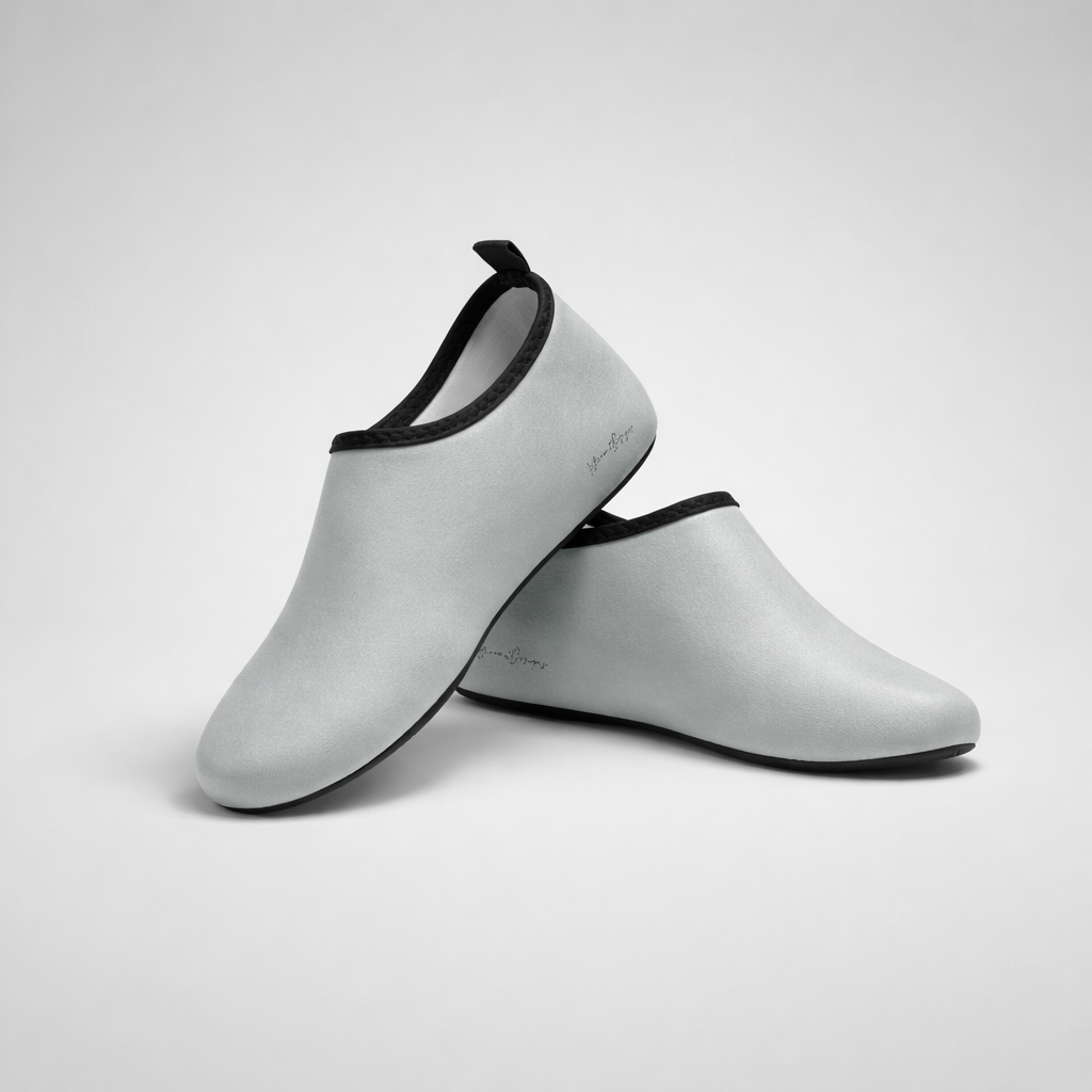 Light gray neoprene aqua shoes with black trim and small logo by barefoot intention for water activities