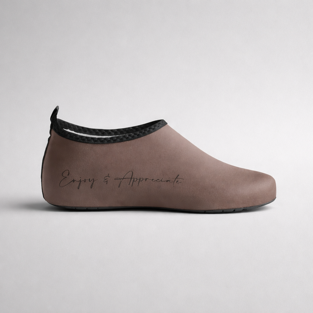 Aqua shoes taupe slip-on with black braided trim and enjoy & appreciate embossed on the side