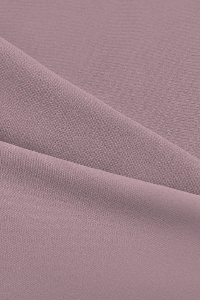 Soft muted mauve racerback sports bra fabric with smooth slightly translucent texture and subtle weave