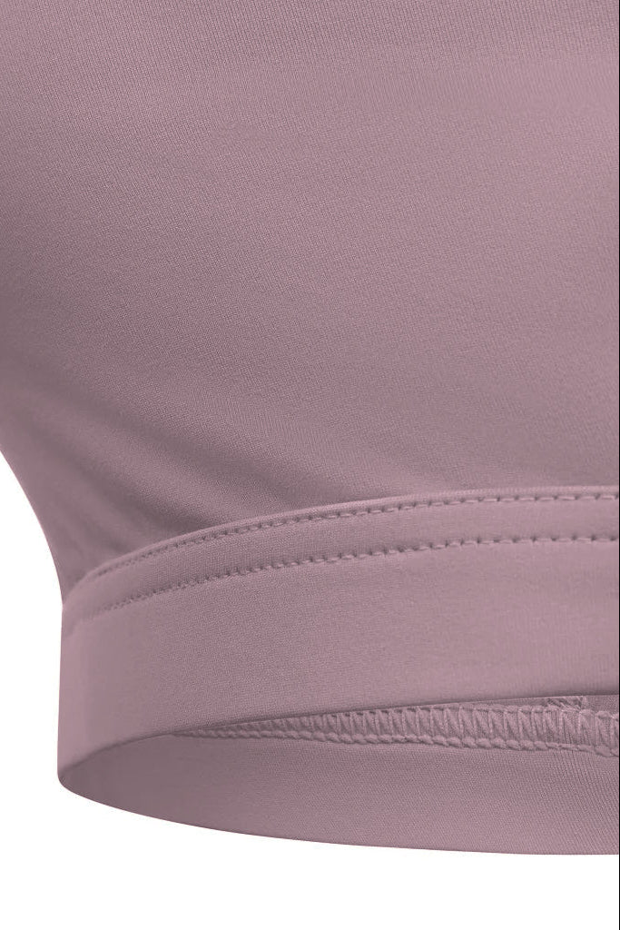 A soft lavender stretchy fabric racerback sports bra with neat stitching along the hem for active wear