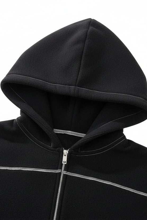 Black hoodie hood detail with a zipper on a white background