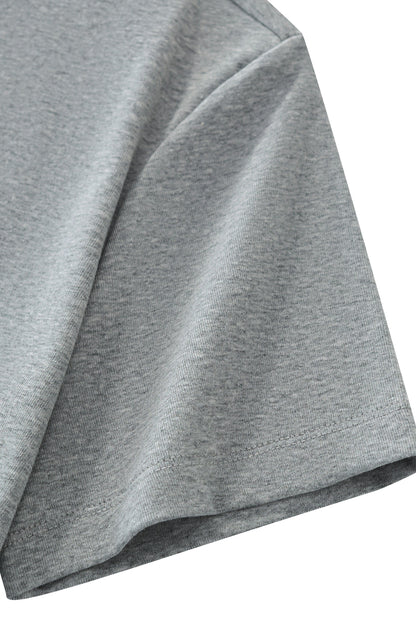 Close-up of a heather gray short-sleeve t-shirt showing the fabric texture and sleeve construction against a white background.