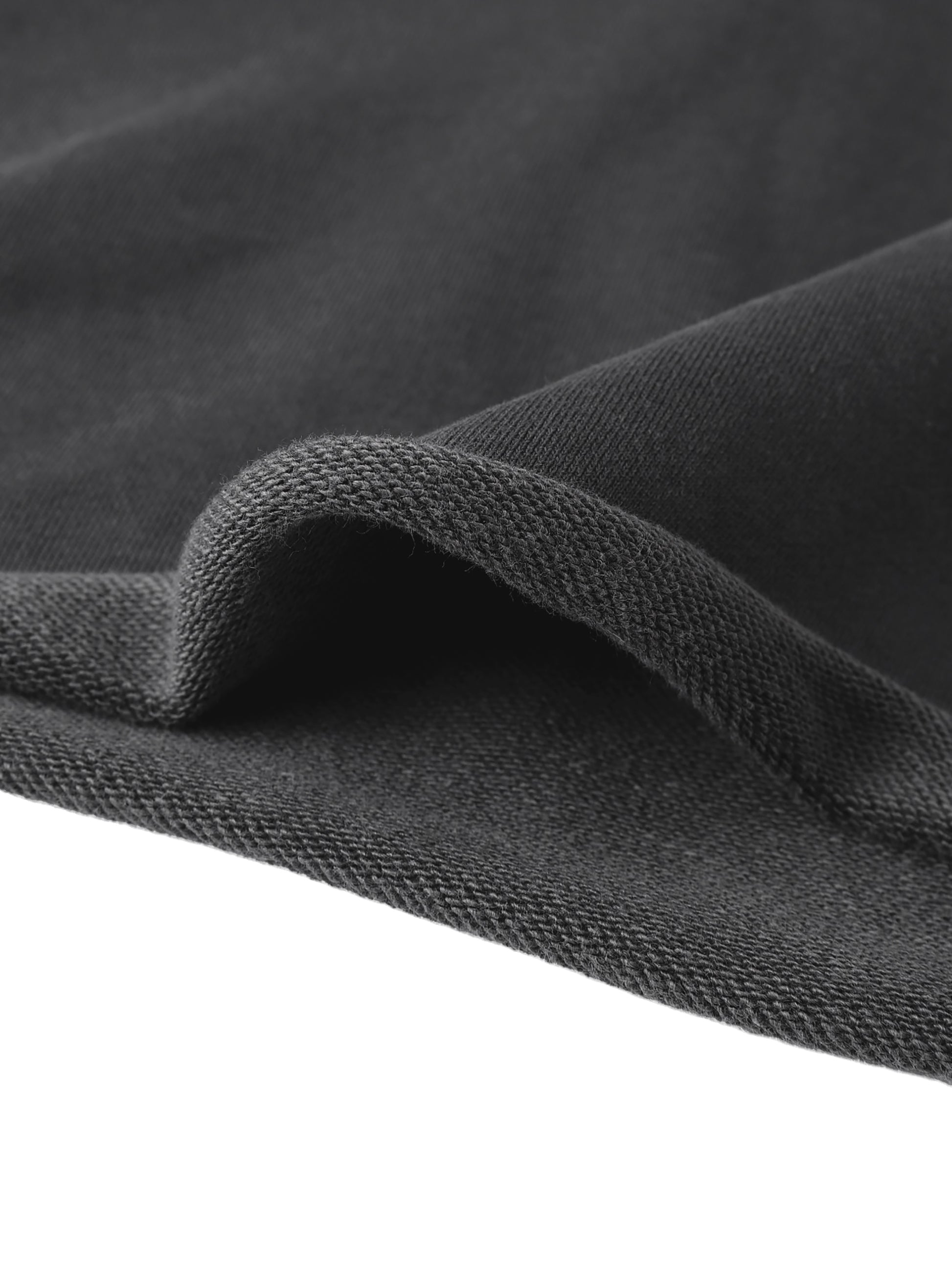 Black textured knit fabric with a soft fuzzy surface for cropped raw edge hoodie material detail