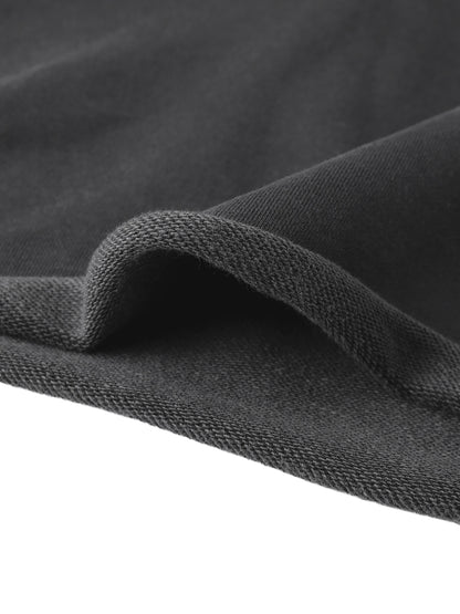 Black textured knit fabric with a soft fuzzy surface for cropped raw edge hoodie material detail