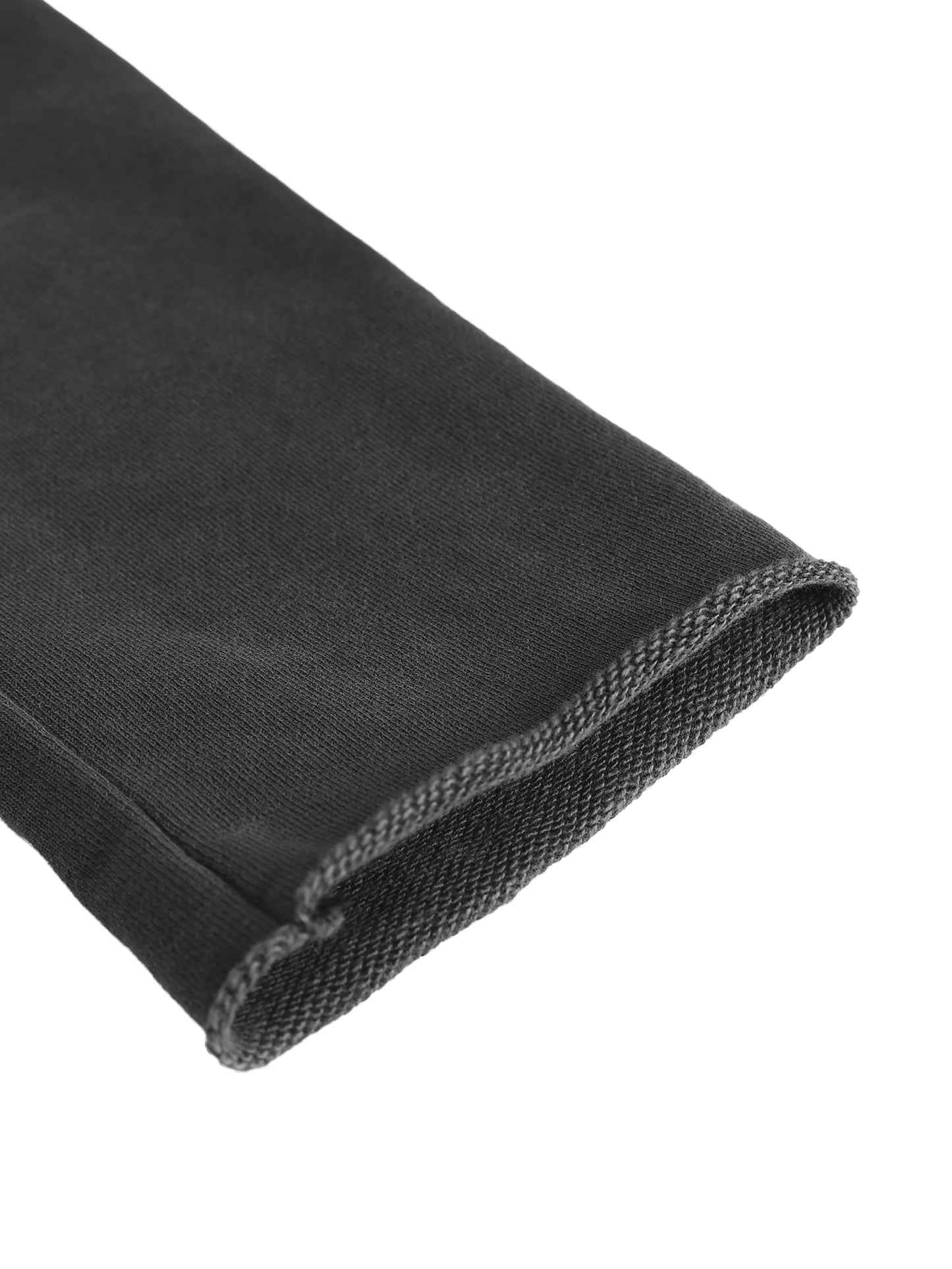 Black stretchy fabric sleeve with ribbed knit cuff on cropped raw edge hoodie for a comfortable fit