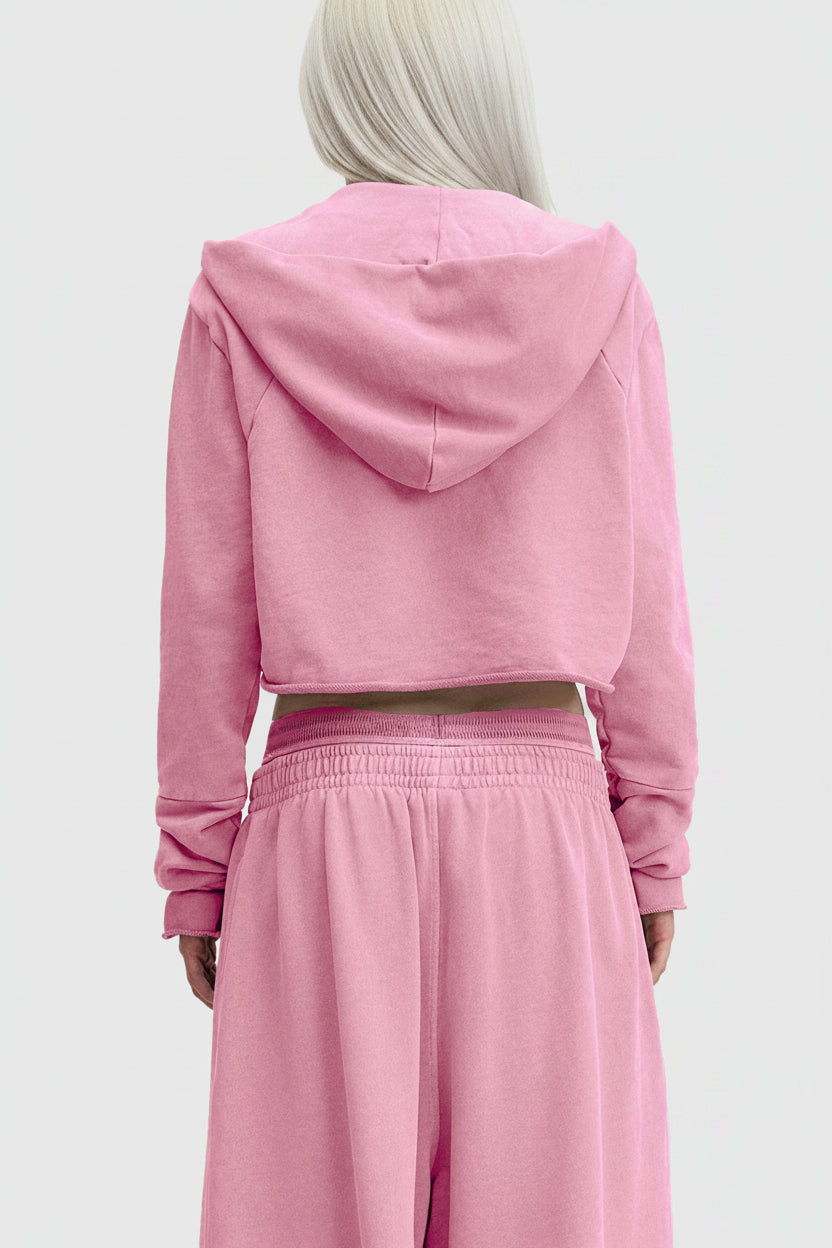 Pink cropped hoodie with long sleeves and hood made of soft cotton fabric for casual wear