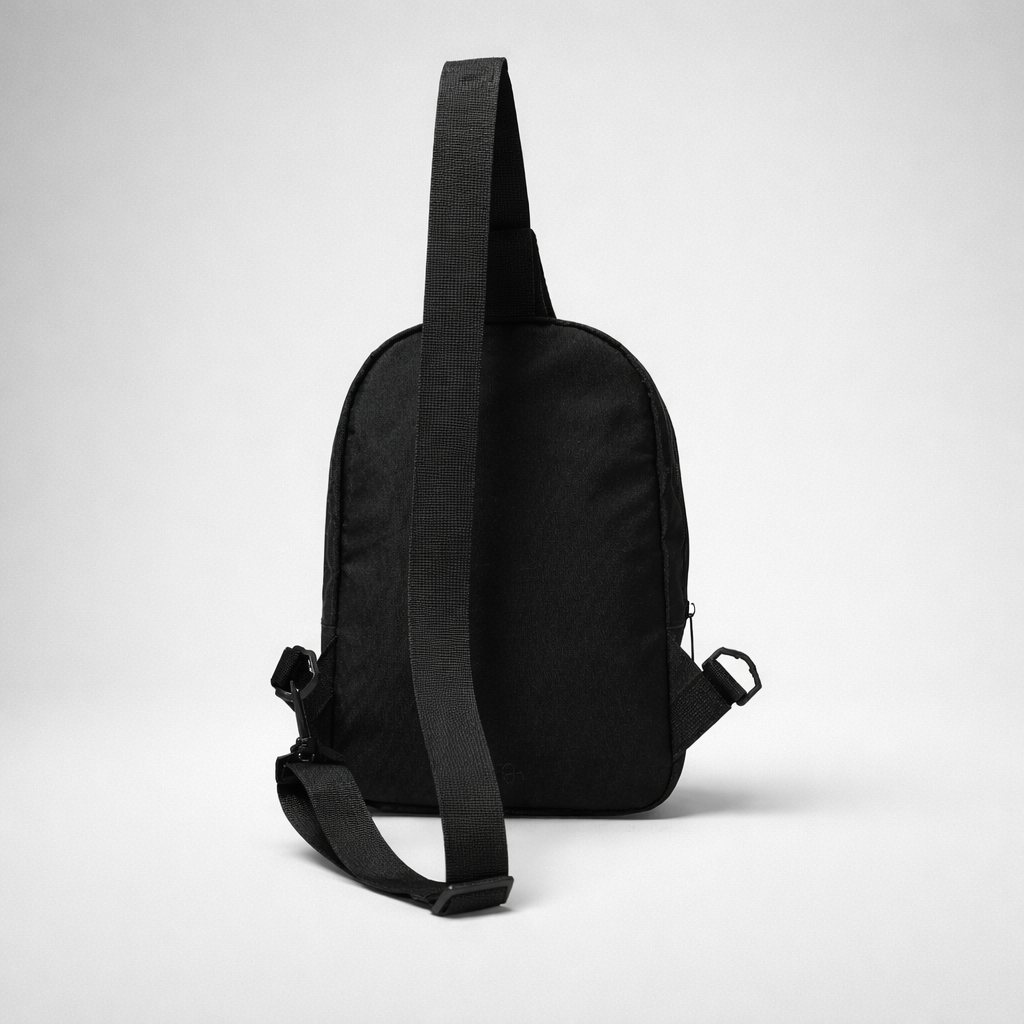 Black nylon crossbody bag with adjustable strap and zipper closure for hands-free carrying