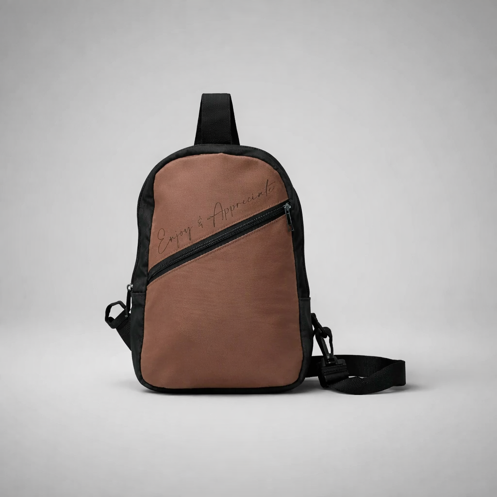 Brown and black crossbody bag with diagonal zipper pocket and enjoy and appreciate embroidery on front panel