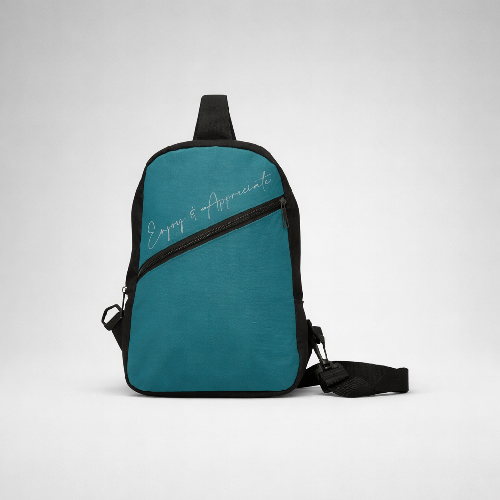 Teal and black crossbody bag with enjoy and appreciate script in white for casual everyday use