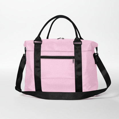 Pink duffel bag with black handles and shoulder strap designed for versatile travel and gym use