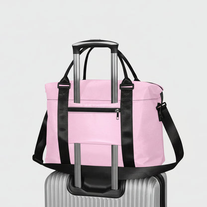 Pink travel duffel bag with black straps and silver telescoping handles for easy transport and durable use