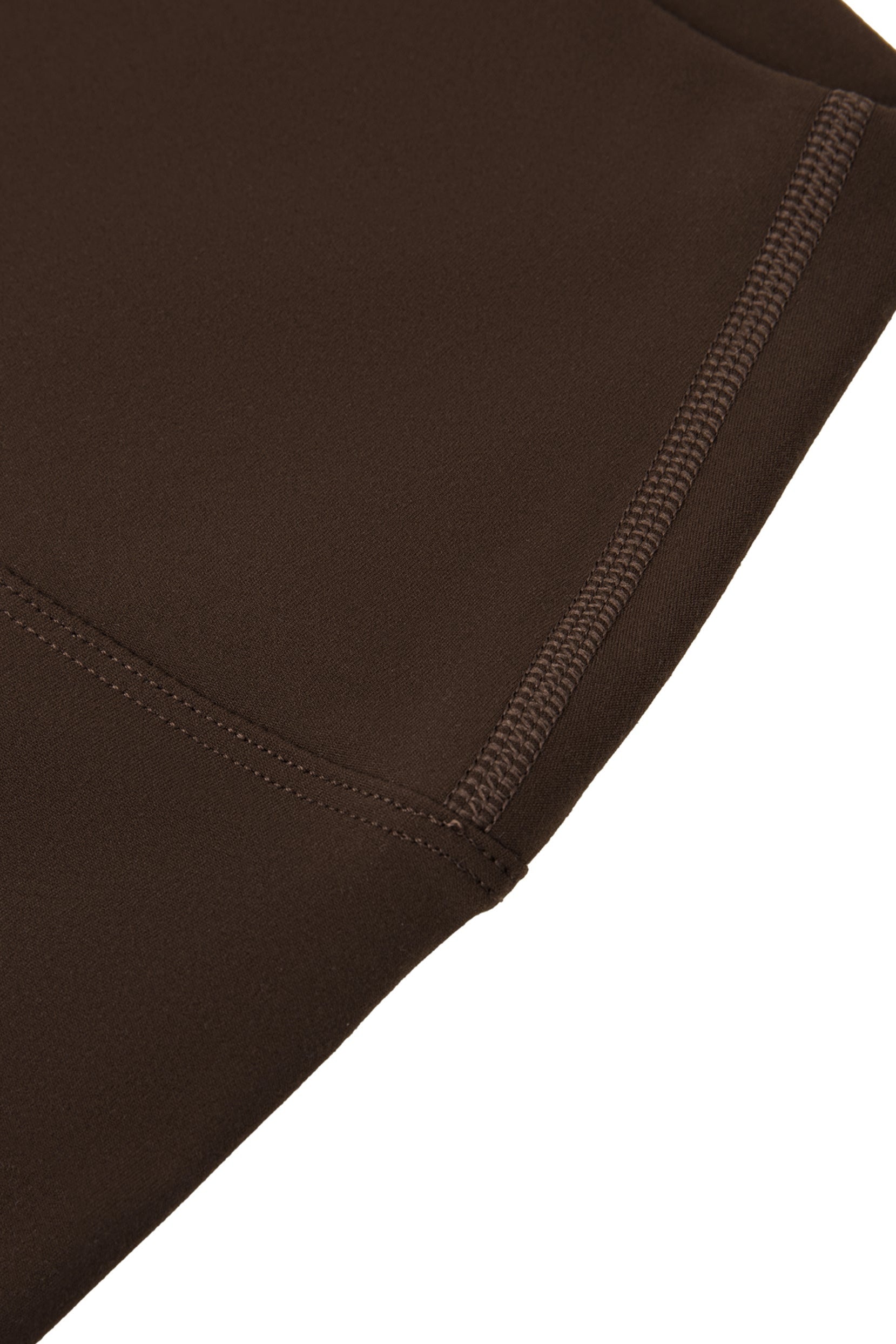 Close-up of brown fabric with a visible seam on a white background