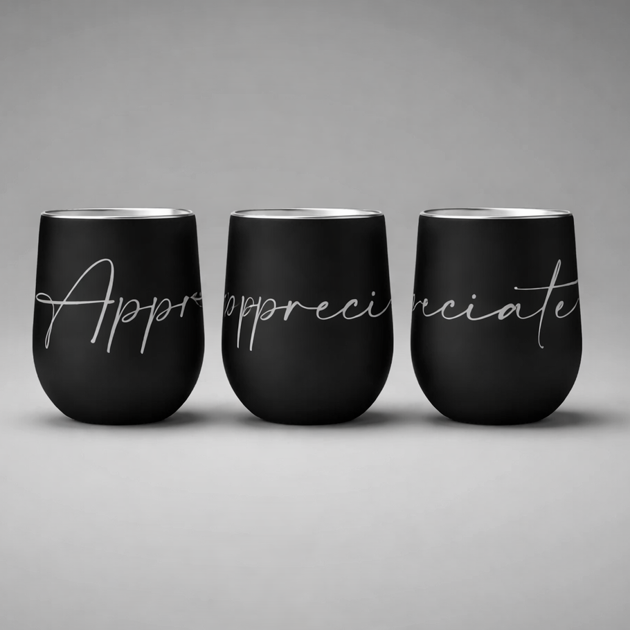 Three black insulated sports cups with silver script appreciate designed for keeping drinks hot or cold
