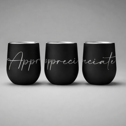 Three black insulated sports cups with silver script appreciate designed for keeping drinks hot or cold