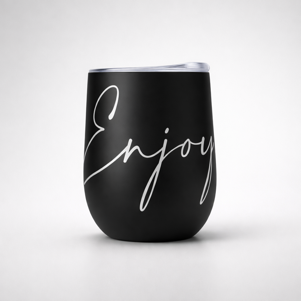 Black matte insulated sports cup with clear lid and elegant white enjoy script in cursive on the front