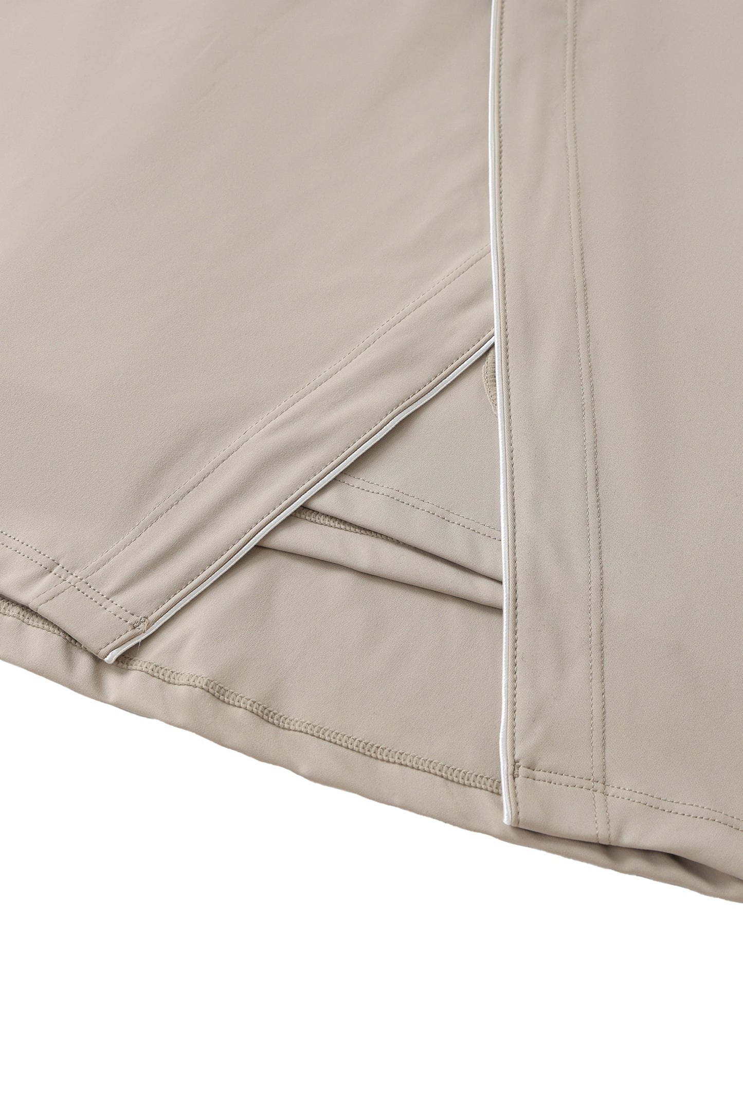 Close-up of beige skort with a white background