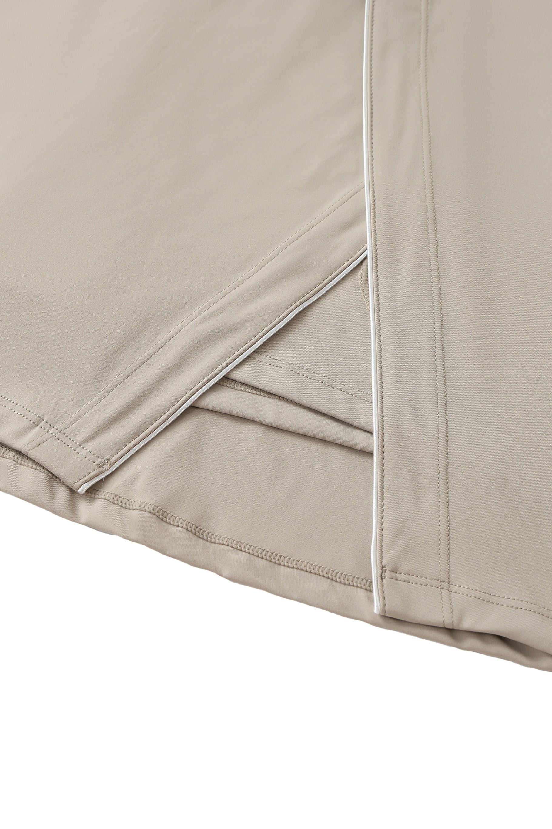 Close-up of beige skort with a white background