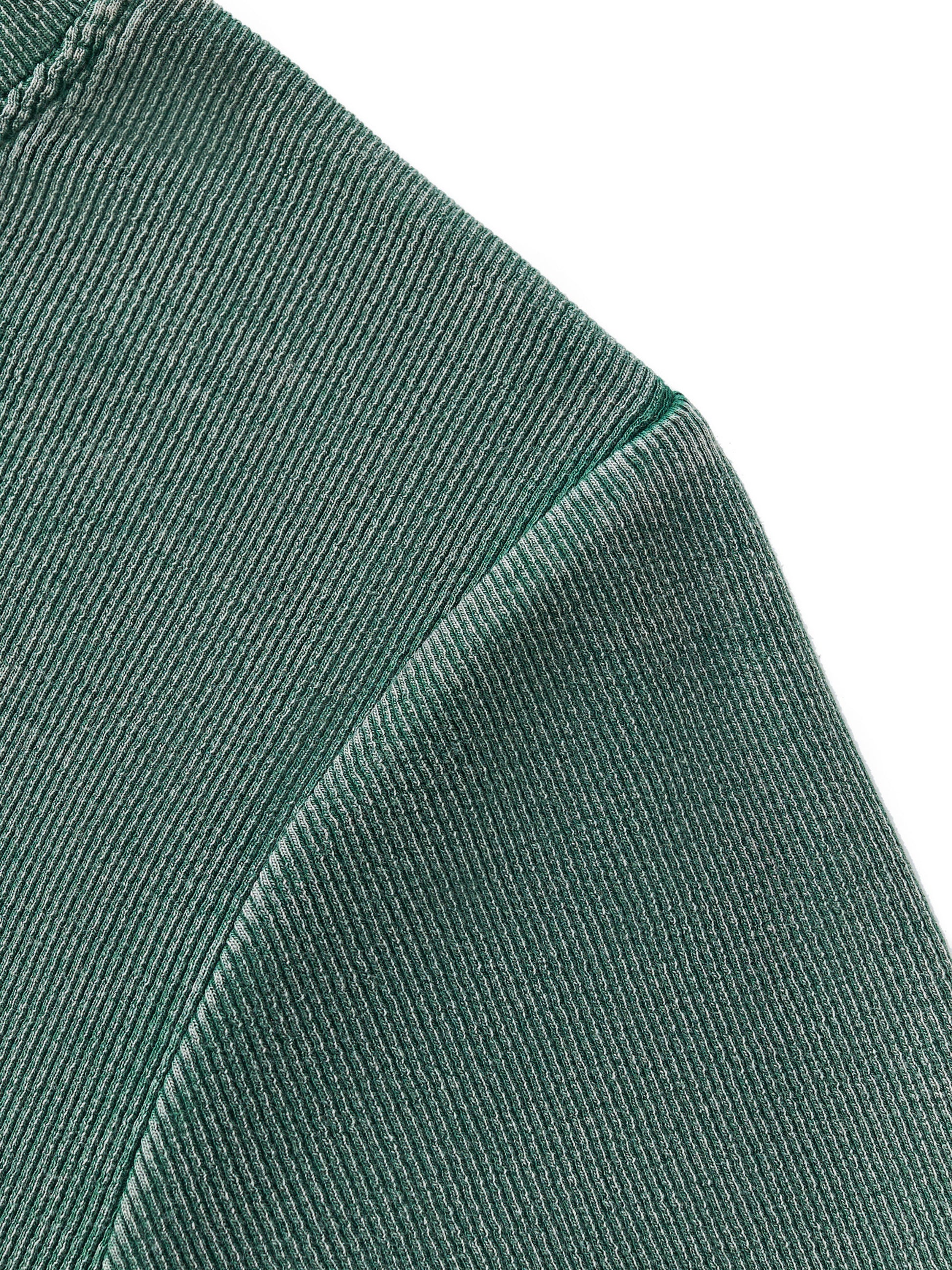 Close-up of green corduroy fabric texture