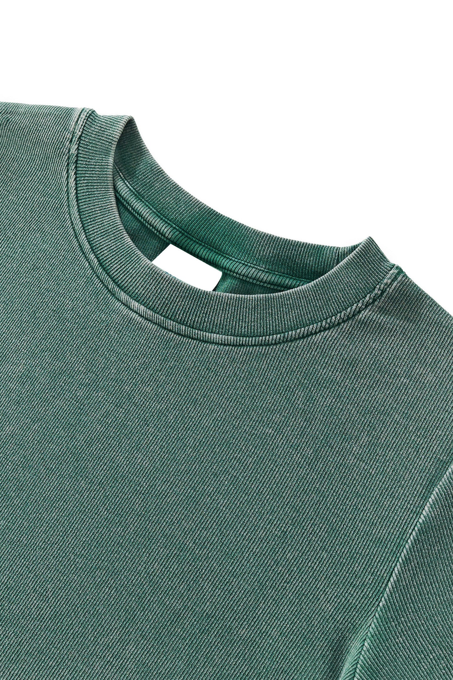 Close-up of a green sweatshirt collar on a white background
