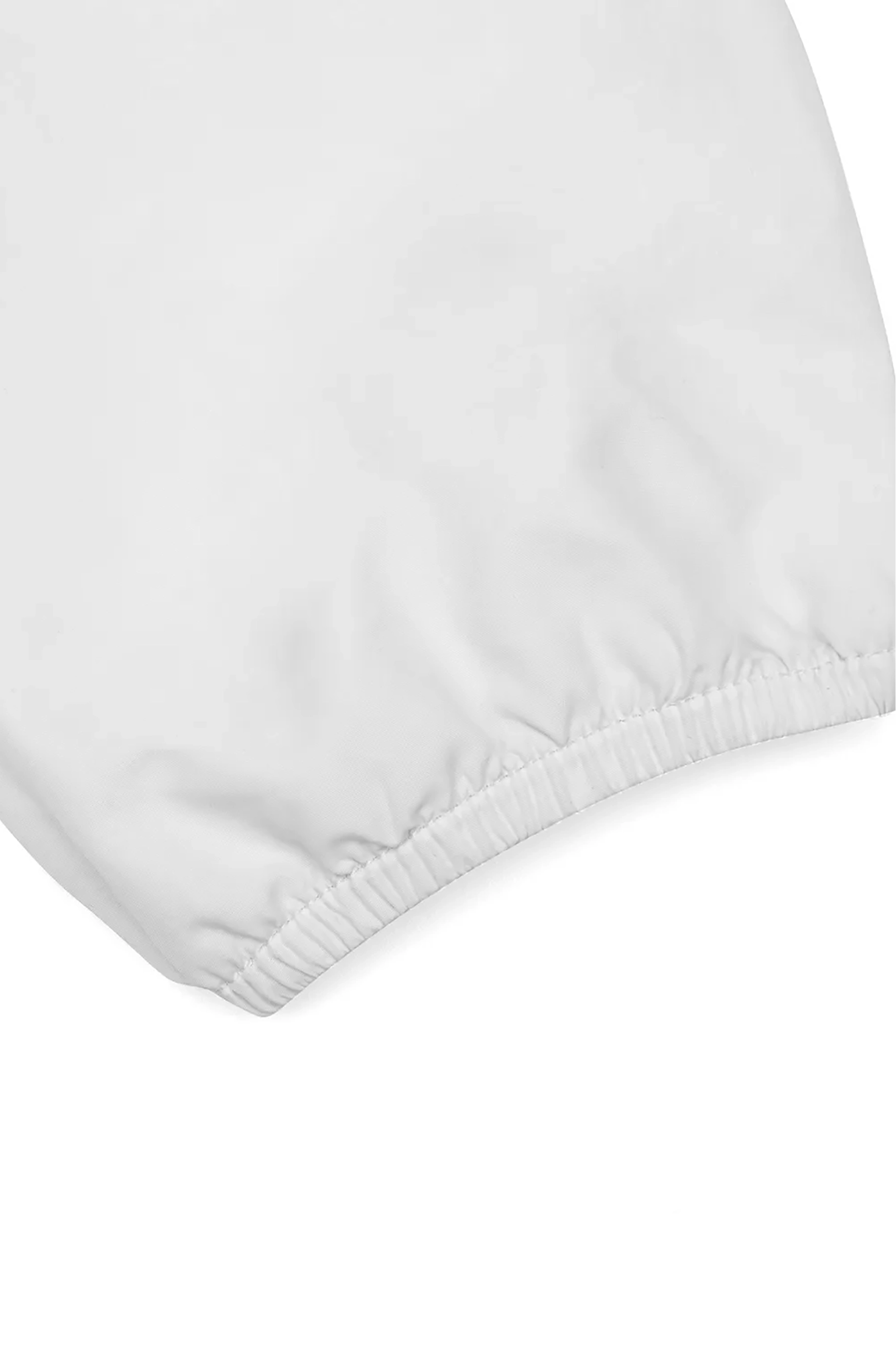 White elastic waistband of a lightweight hoodie sports jacket showcasing comfort and flexibility features