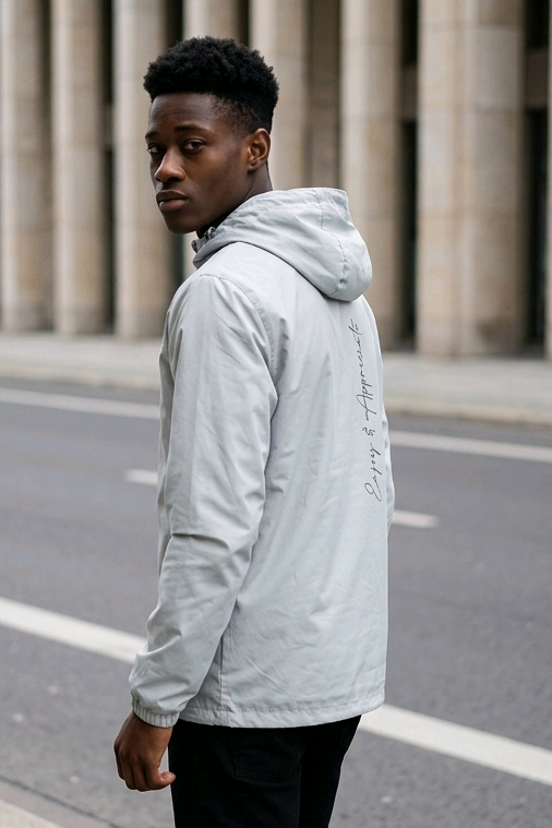 Light gray lightweight hoodie sports jacket showing the back with a subtle handwritten script design on fabric