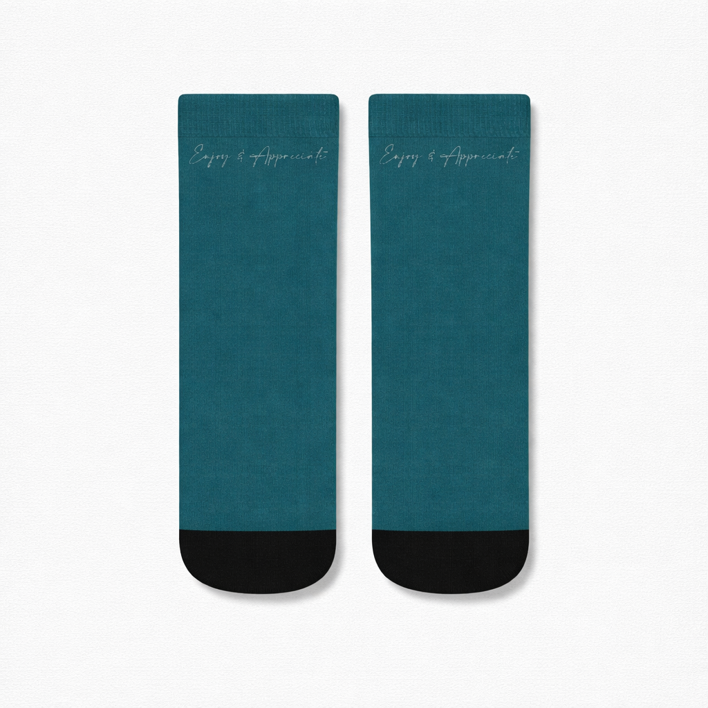Ankle socks in teal and black with enjoy and appreciate embroidered in silver script for daily comfort and style