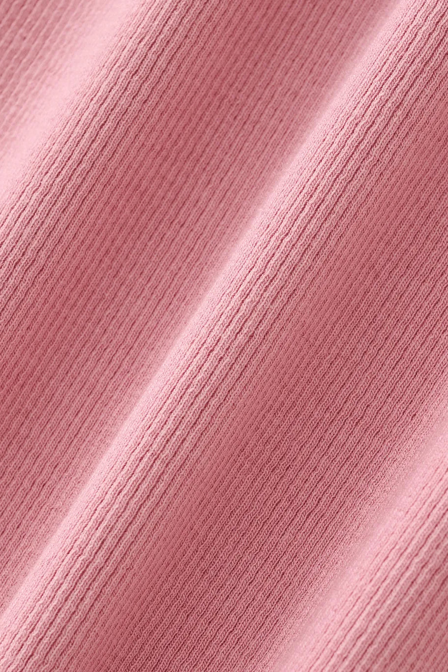 Close-up of a pink textured fabric surface