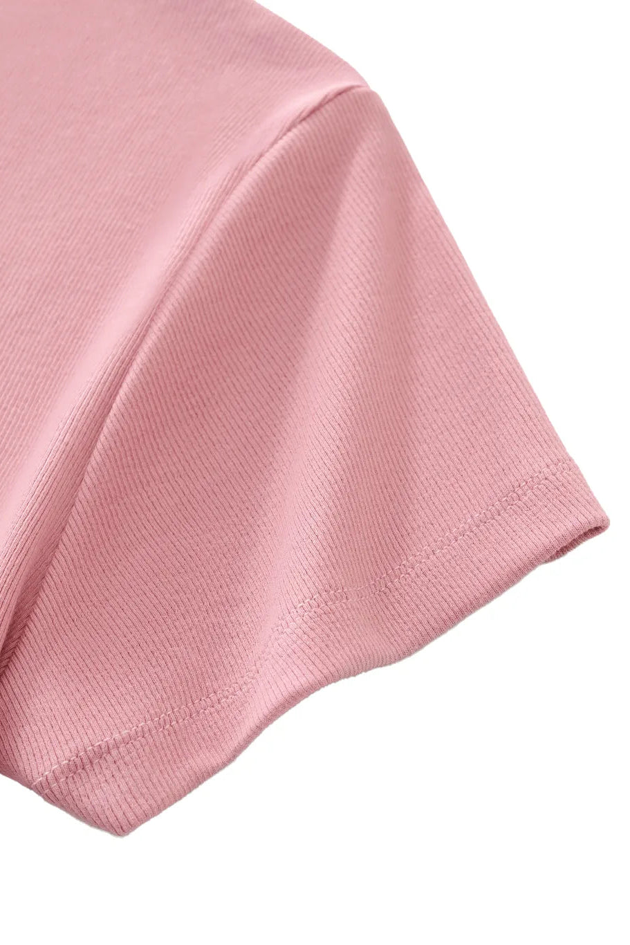 Close-up of a pink fabric sleeve detail texture on a white background