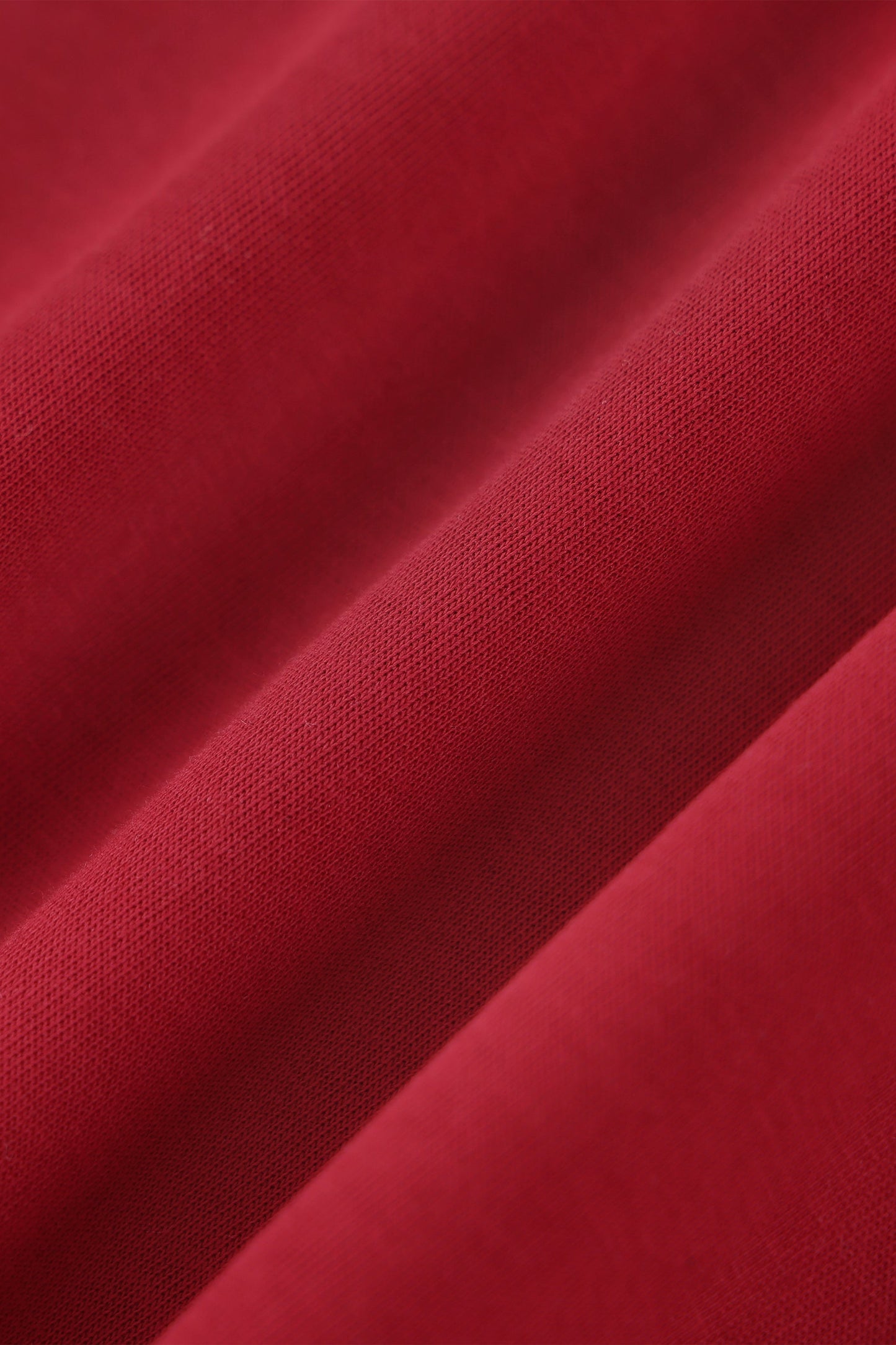 Close-up of red fabric with a textured pattern