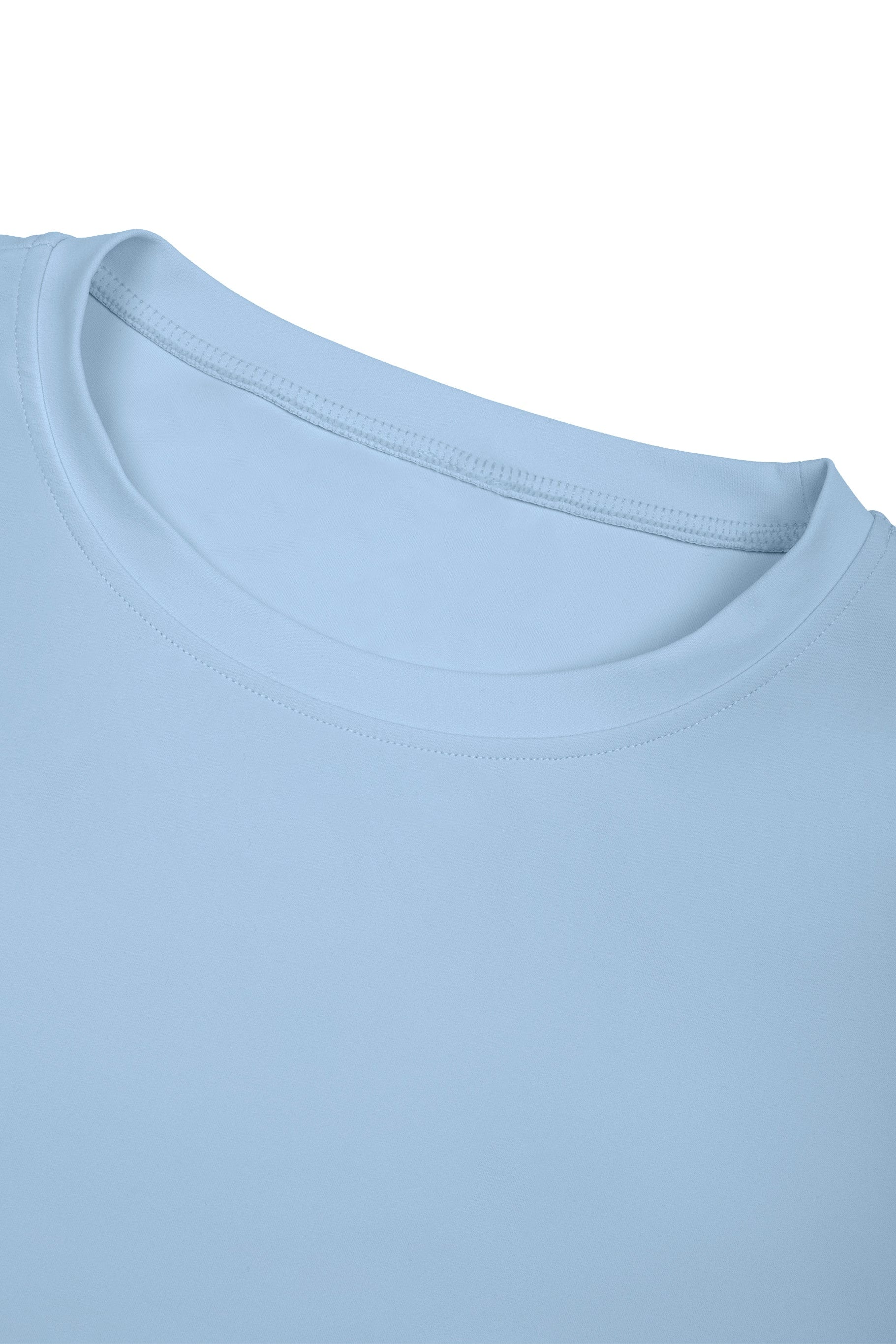 Close-up of a light blue t-shirt with a plain background