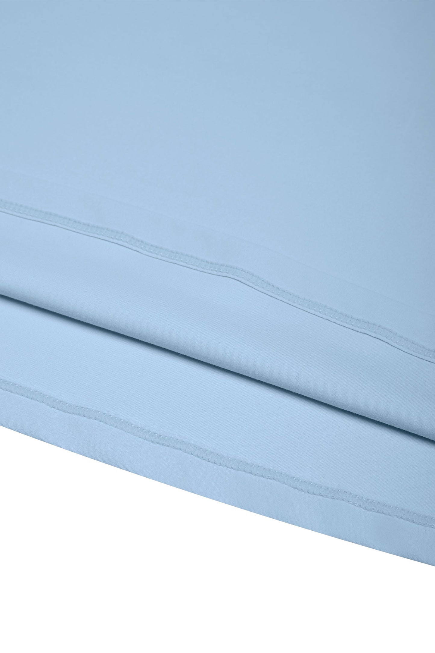 Light blue fabric with a subtle pattern on a white background