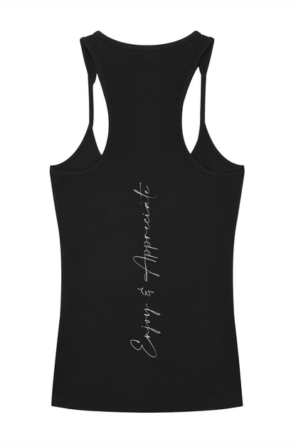 Black racerback tank top with a white vertical cursive enjoy and appreciate inscription on the back