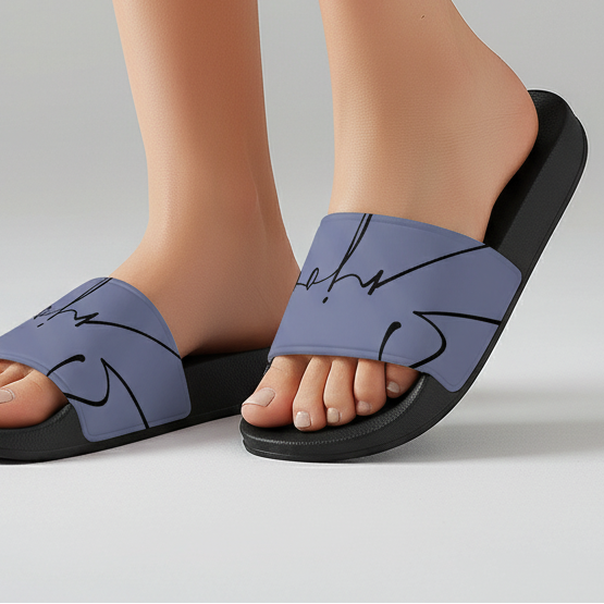 Slip-on blue slide sandals with black abstract line art design on adjustable straps for casual wear