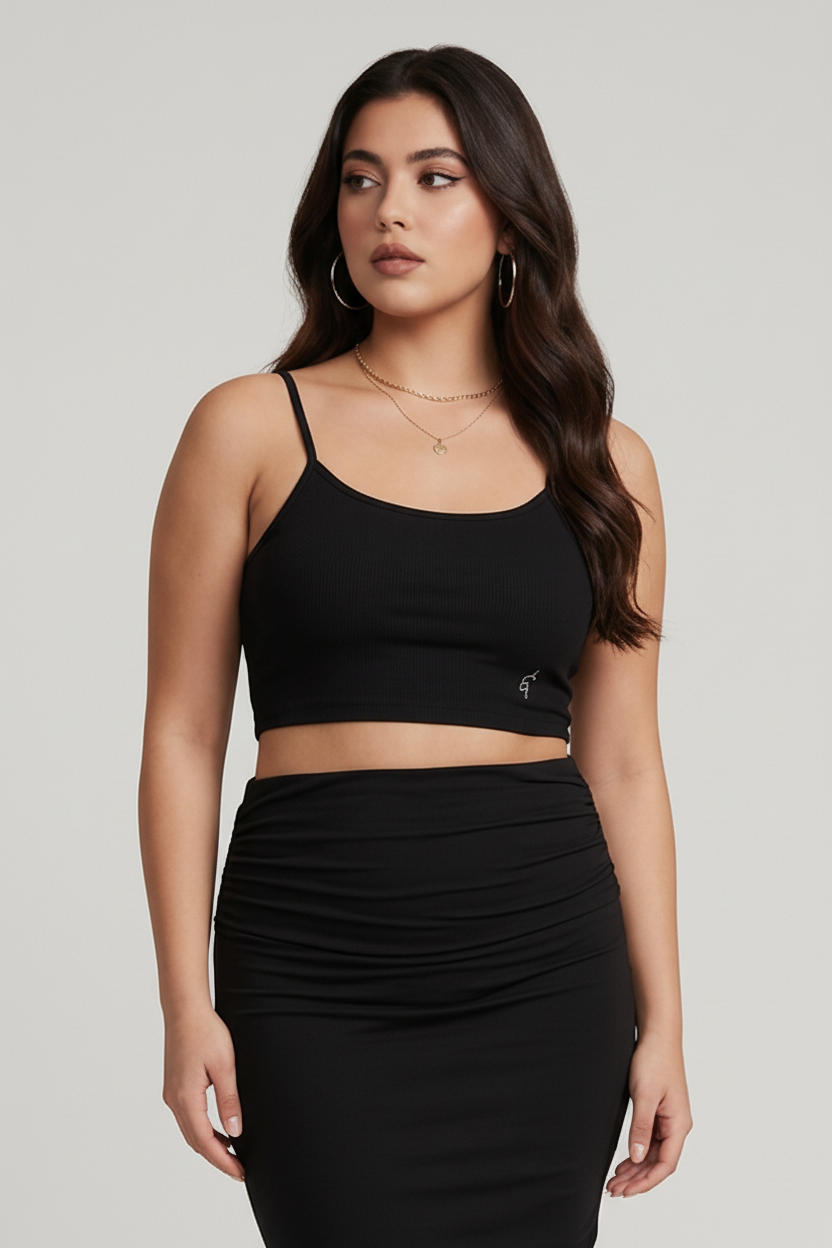 Black cropped sports bra with spaghetti straps and small logo on lower left side for activewear use