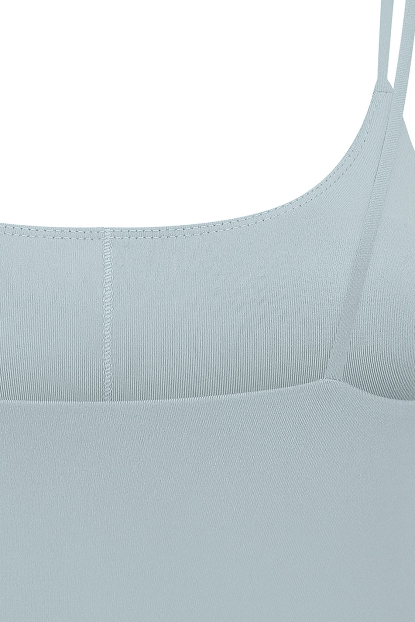 Light blue sports bra with ribbed fabric and spaghetti straps featuring a smooth seamless design