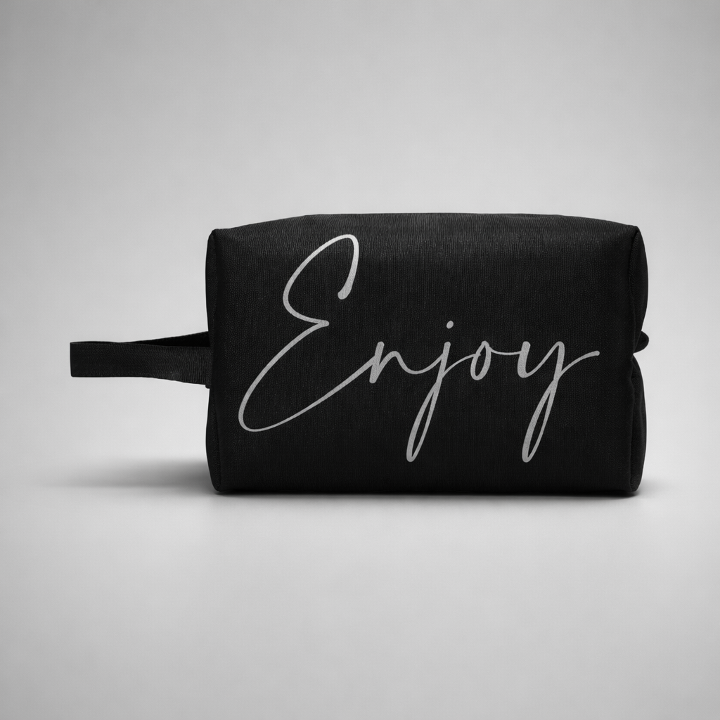 Black fabric sports toilet bag mini with silver cursive enjoy lettering and short handle for easy carrying