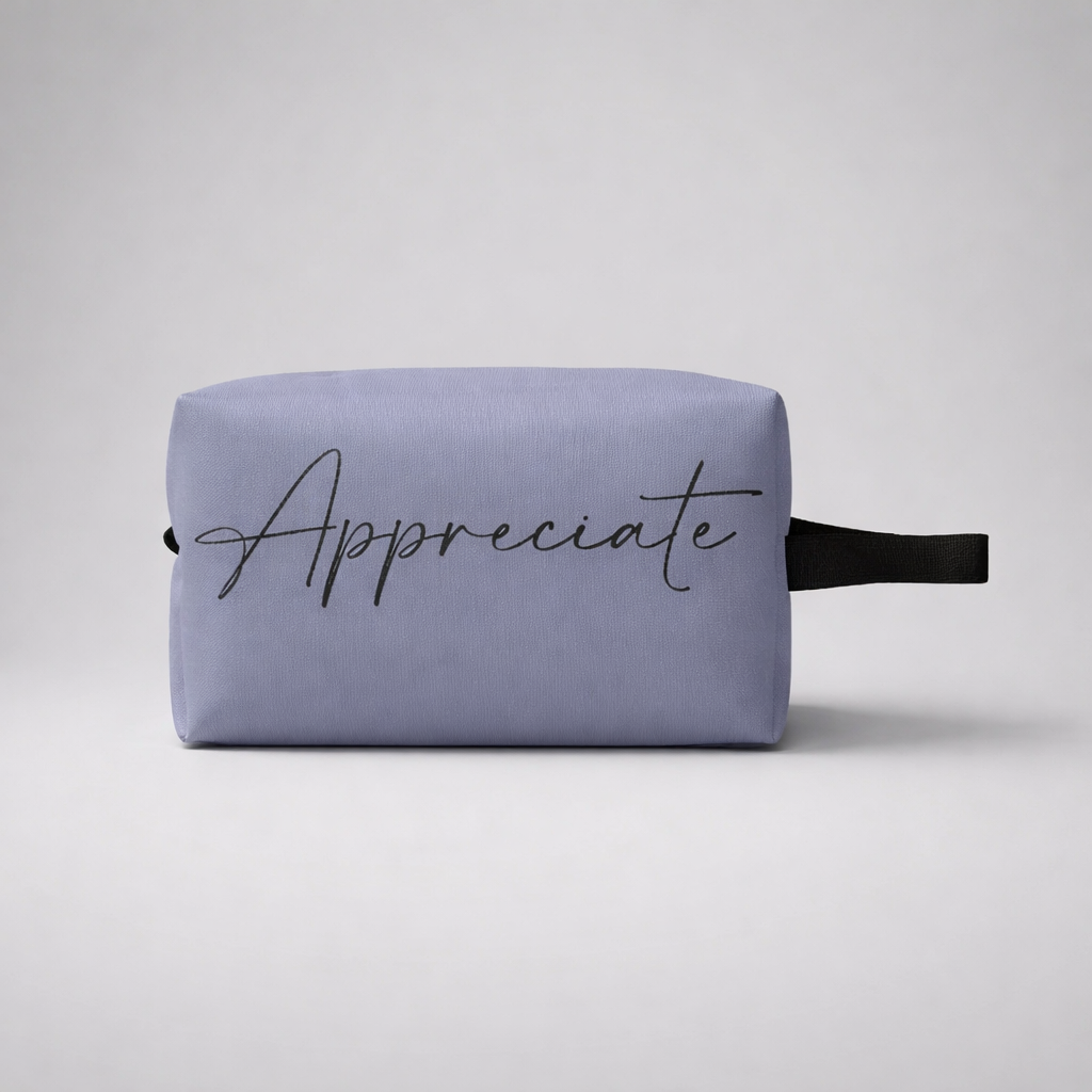 Lavender fabric sports toilet bag mini with black cursive appreciate print and matching black strap for travel use