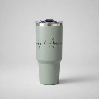 A matte sage green insulated sports mug with silver rim and clear lid featuring elegant black cursive lettering