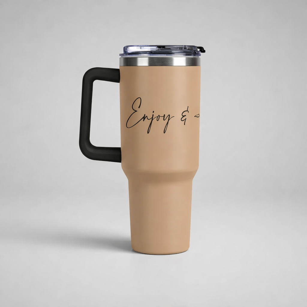 Tan insulated travel mug with black handle silver rim and enjoy and cursive script for sports mug to enjoy and appreciate