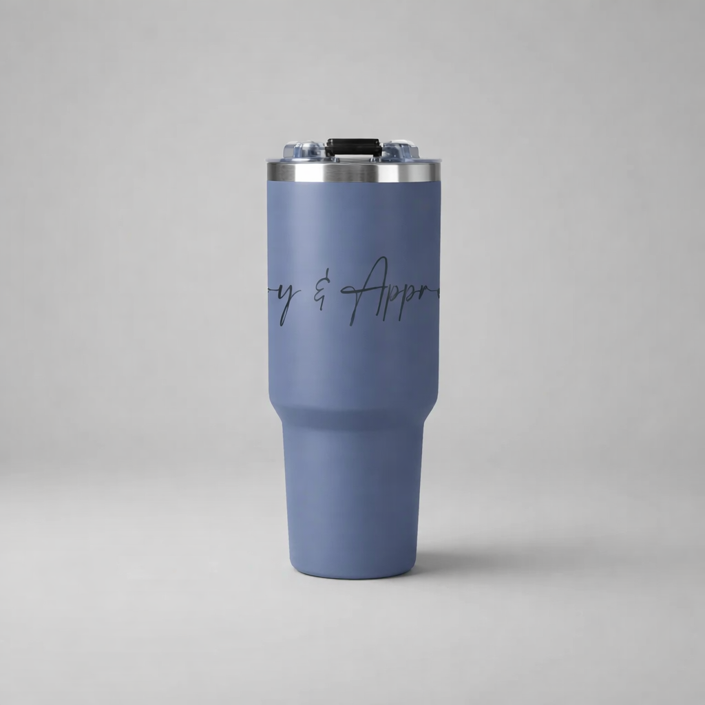 A matte blue insulated sports mug with a silver lid and black cursive text to enjoy and appreciate