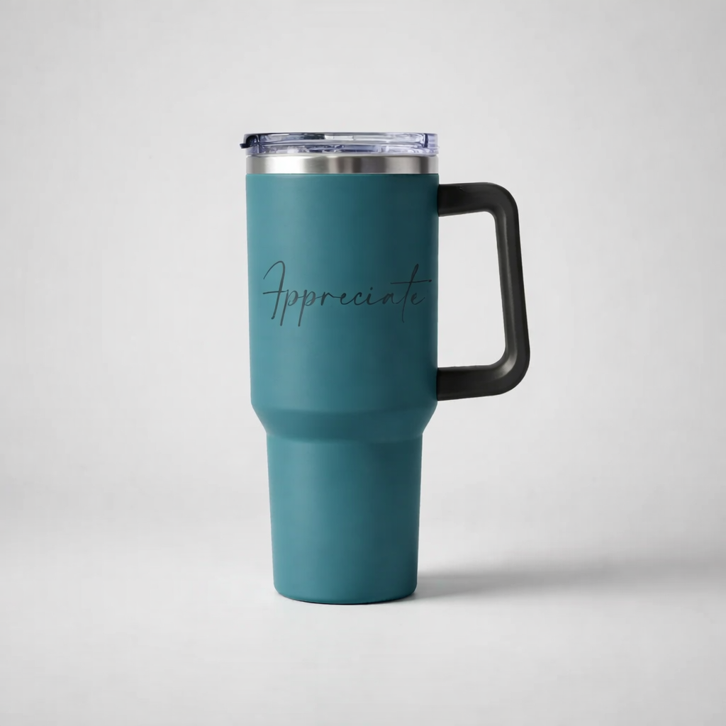 Teal insulated sports travel mug with black handle and clear lid featuring appreciate in cursive script for on the go use