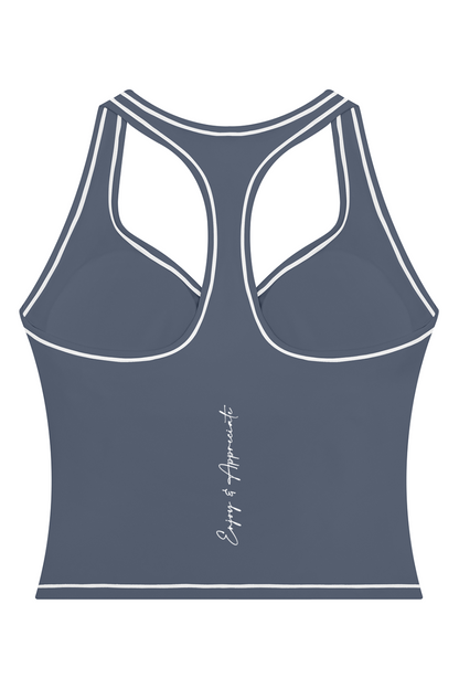 A dark slate blue racerback tank top with white contrast stitching and a small white script logo on the lower back, shown on a plain white background.